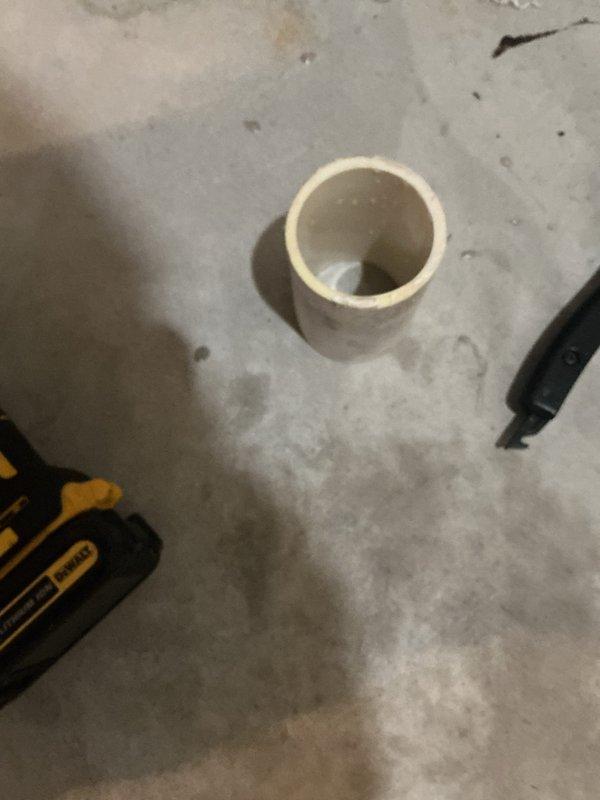 Replaced defective rubber coupling on furnace PVC vent pipe that was causing water leakage. Installed new PVC coupler to properly connect the previously broken PVC sections, eliminating condensation buildup and resolving the drainage issue.