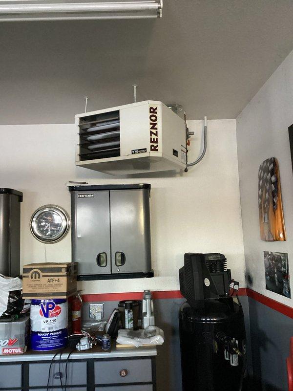 Responded to a service call for a unit not heating. Upon inspection, determined the inducer was plugged rather than a faulty gas valve as initially diagnosed. Cleared the inducer blockage, which successfully restored system operation. The Reznor heating unit mounted on the wall is now functioning properly.