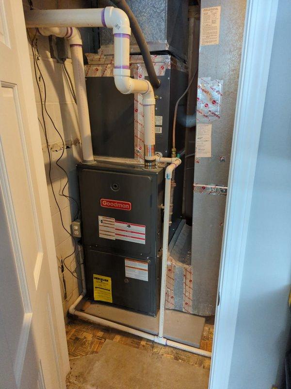 Diagnosed Goodman furnace with no heat complaint and found failed inducer motor and worn ignition assembly. Replaced both components, restoring proper operation to heating system.