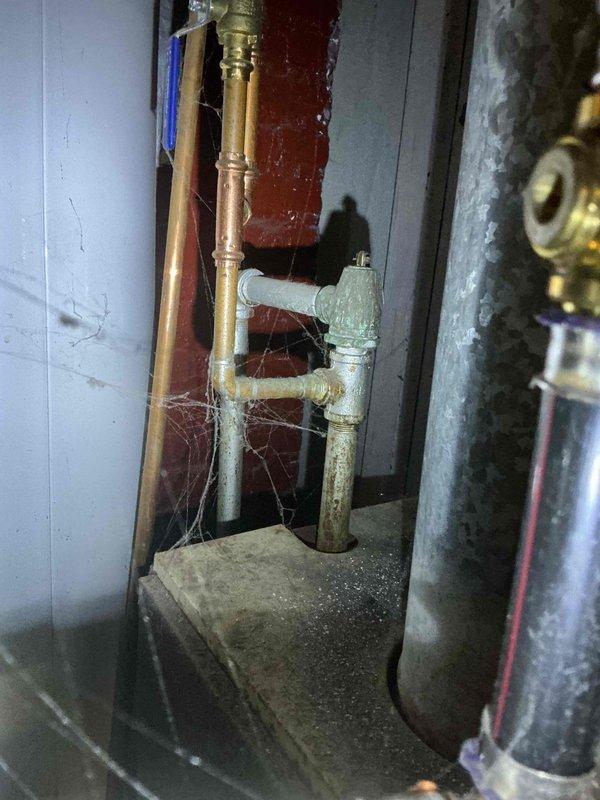 Diagnosed non-functional boiler with no heat output. Inspection revealed failed transformer causing control system malfunction. Documented aged condition of unit with visible wiring deterioration and pipe oxidation. Provided customer with estimate for replacement components.