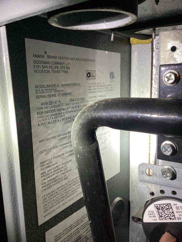 Responded to no-heat call on 20+ year old Amana/Goodman furnace. Diagnosed multiple issues including faulty door safety switch, temporarily jumpered for testing. Found pressure switch error caused by compromised hose which was replaced, resolving ignition failure. Noted inducer motor operating loudly though functionally. Inspected heat exchanger with no compromised areas found. Advised customer that return visit needed to properly replace door switch and recommended evaluation of pressure switch and inducer motor. Due to age and condition of unit, scheduled comprehensive system evaluation to discuss replacement options.
