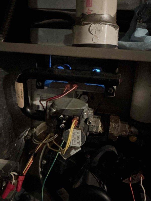 Responded to no heat complaint at rental property with 18-year-old Coleman furnace. Diagnosed multiple issues including burner ignition failure, condensate drainage problems, and potential heat exchanger concerns based on erratic combustion analysis readings. Performed temporary repairs by clearing orifices, adjusting gas valve, disassembling draft motor assembly to clear condensate trap, and ensuring pressure switches/vacuum hoses were unobstructed to restore heat temporarily until permanent solution can be implemented.