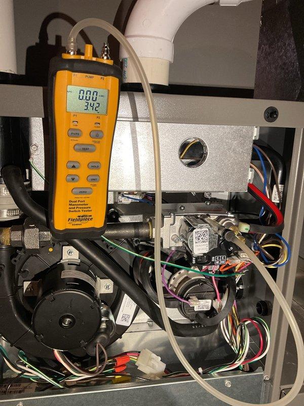 Responded to customer's call for 1-year-old non-functioning furnace with flashing red light. Diagnosed system and found no fault codes; unit successfully ignited on second attempt. Performed comprehensive maintenance including burner inspection, gas pressure verification, and wire tightening. Conducted multiple system restart tests with all successful ignitions on first attempt, and confirmed proper operation in both first and second stage. No issues detected during service.