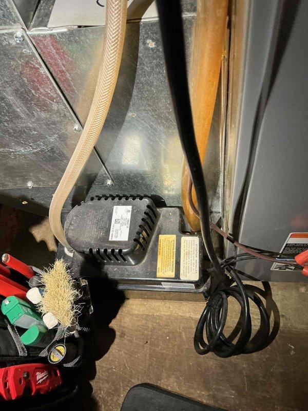 Performed standard furnace tune-up on residential FRP unit of unknown age. System inspection revealed normal operation with no immediate concerns. Conducted comprehensive maintenance including combustion analysis, gas pressure verification, inspection of heat exchanger, flame sensor, burners, and blower components. Confirmed proper thermostat operation and heating performance. Air filter in good condition; cleaned pressure switch. Documented system with photos showing ductwork configuration and motor assembly.