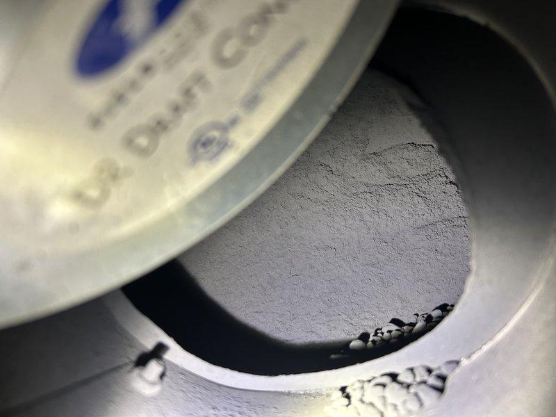 Inspected oil furnace after customer reported soot throughout house following service by another company. Found incorrect nozzle size had been installed previously, causing extensive soot accumulation in mechanical room, clean-outs, burn chamber, and chimney. Tagged out and shut down furnace due to safety hazards from improper venting through baro damper. Advised customer that heat exchanger replacement would be required and recommended chimney cleaning; scheduled consultation for gas furnace conversion options.