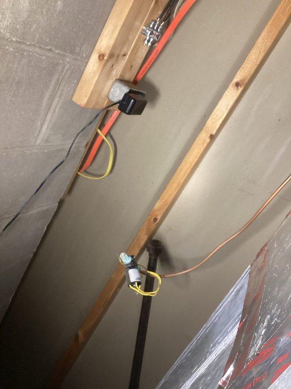 Removed leaking humidifier system including saddle valve on water supply line. Cut out affected section of water piping, installed replacement piping, and restored water supply. Properly disconnected all humidifier water connections to eliminate the leak from failing solenoid valve.