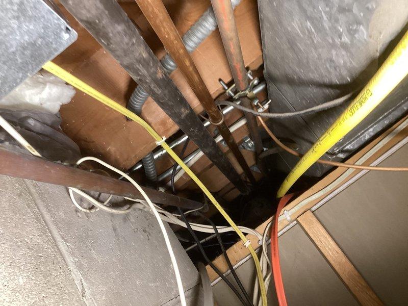 Removed leaking humidifier system including saddle valve on water supply line. Cut out affected section of water piping, installed replacement piping, and restored water supply. Properly disconnected all humidifier water connections to eliminate the leak from failing solenoid valve.