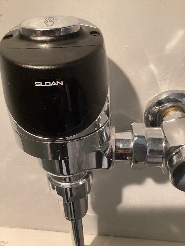 Responded to a reported low water pressure issue at restaurant. Diagnosed problem as leaking urinal affecting building pressure. Isolated urinal water supply while restoring main water service to kitchen. Tested urinal functionality after restoration, confirming both push button and motion sensor operation functioned properly. Restored normal water pressure to establishment.
