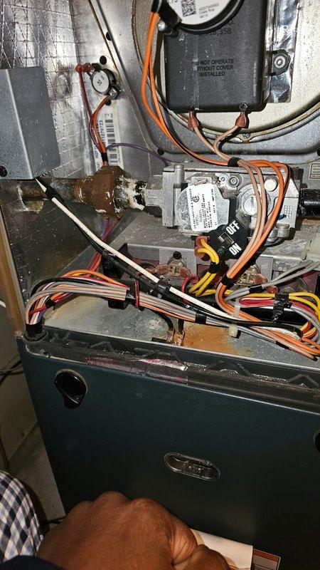 Responded to customer report of slow furnace ignition and gas odor. Diagnosed issue with clogged air filter causing system to overheat and short cycle. Performed comprehensive inspection of flame sensor, ignitor, safety switches, pressure switch, inducer, burners, heat exchanger, gas valve and connections. Customer replaced filter during visit. System now operating within normal parameters with proper temperature split and gas pressure verified.