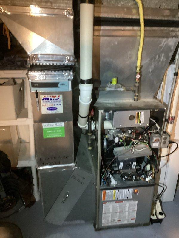Diagnosed 10+ year old natural gas furnace with error code 31. Conducted comprehensive inspection of flame sensor, ignitor, safety components, and condensate systems. Identified leaks in secondary heat exchanger requiring replacement. Temporarily restored operation and scheduled comfort advisor for heat exchanger replacement estimate.
