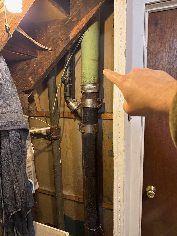 Located and repaired a vertical pipe leak in basement that was occurring when bathroom water was running. Replaced deteriorated copper pipe showing significant oxidation and green patina at joints. Also replaced faulty shower cartridge which was contributing to the leaking issue.