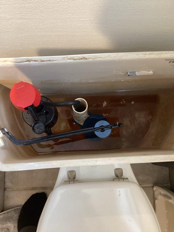 Responded to a service call for a constantly running toilet. Visual inspection revealed worn internal components causing continuous water flow. Replaced complete toilet flush mechanism including fill valve, flapper, and overflow tube to resolve the issue. Confirmed proper functionality with several test flushes after installation.