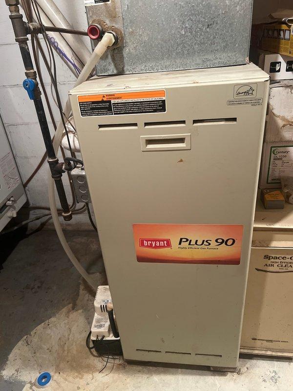 Performed tune-up inspection on 25-year-old Bryant Plus 90 high-efficiency furnace exhibiting progressive rattling, banging during startup, and chirping noises while running. Diagnostic testing with Testo 310 II analyzer revealed exhaust fan malfunction and failed heat exchanger, with combustion readings showing elevated CO levels (123 ppm) and O₂ at 9.7%. System determined unsafe for continued operation; recommended full replacement and arranged comfort advisor consultation.