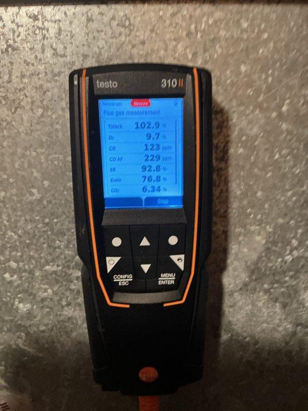 Performed tune-up inspection on 25-year-old Bryant Plus 90 high-efficiency furnace exhibiting progressive rattling, banging during startup, and chirping noises while running. Diagnostic testing with Testo 310 II analyzer revealed exhaust fan malfunction and failed heat exchanger, with combustion readings showing elevated CO levels (123 ppm) and O₂ at 9.7%. System determined unsafe for continued operation; recommended full replacement and arranged comfort advisor consultation.
