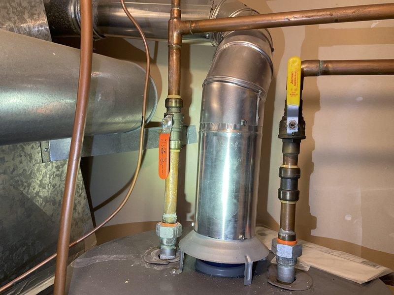 Inspected non-functional Culligan water softener system showing significant deterioration, including visible oxidation on copper pipes and water damage on surrounding wall. System exhibited structural damage that compromises functionality. Provided comprehensive replacement options to client after evaluation of current unit's condition.