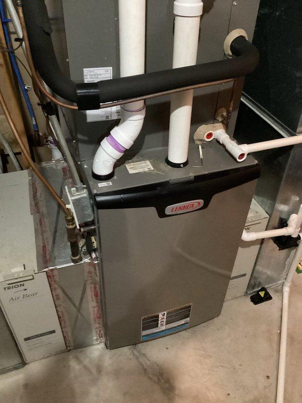 Performed comprehensive inspection on 2-year-old Lennox furnace reported to struggle maintaining temperature during extreme cold conditions. Identified system as slightly undersized for application; increased fan speed by 6% to improve performance. Discovered air filter gap allowing bypass of unfiltered air; provided estimate for filter boot replacement to prevent blower contamination. Combustion test confirmed 94.1% efficiency with normal CO readings (14 ppm).