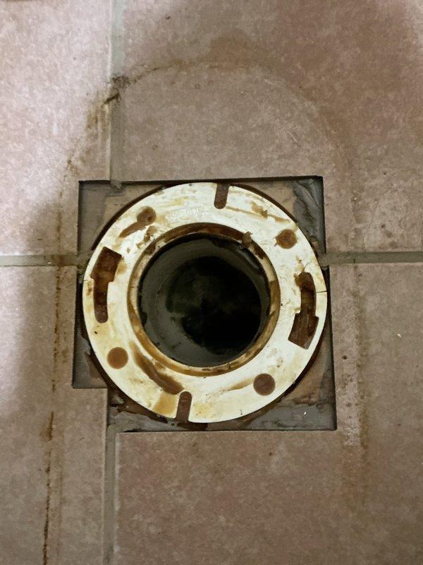 Responded to service call for toilet leaking at the base when flushed. Diagnosed failed wax seal and broken closet flange that was positioned below floor level. Replaced the damaged flange, elevated it to proper installation height, and installed new wax seal to resolve the leak.
