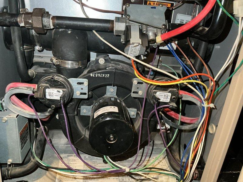 Responded to no heat call for 8-12 year old furnace that was blowing cold air after temperature adjustment. Upon inspection, identified a failed inducer motor and cracked heat exchanger as the root causes. Due to safety concerns and extent of damage, recommended complete furnace replacement as repair was not viable.