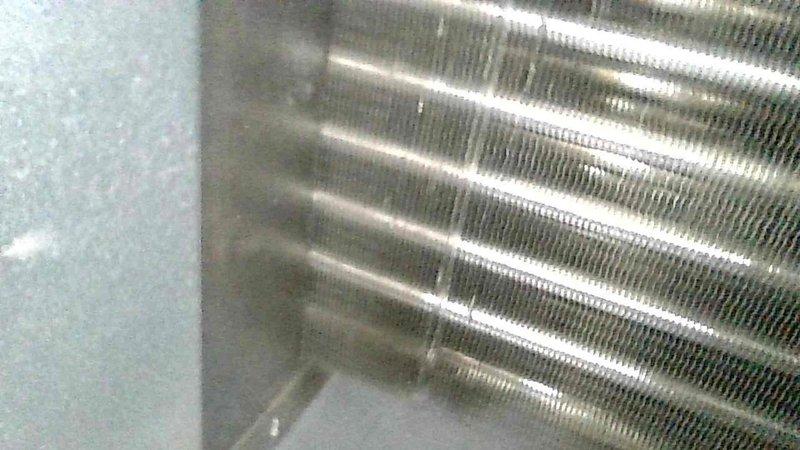 Performed comprehensive furnace tune-up on 2-year-old FRP unit. Replaced customer-supplied dirty filter, inspected electrical components and heat exchanger (all within specifications), verified condensate drainage, and confirmed proper venting with 60-degree temperature rise during 20-minute maximum heat rate test. System functioning correctly; advised customer to replace filter monthly.