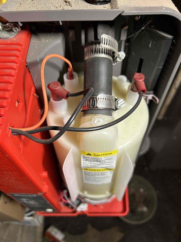 Replaced humidifier canister on Honeywell steam humidifier system. Removed old canister, installed new replacement unit, secured all connections and verified proper operation. System is now functioning correctly with no issues.