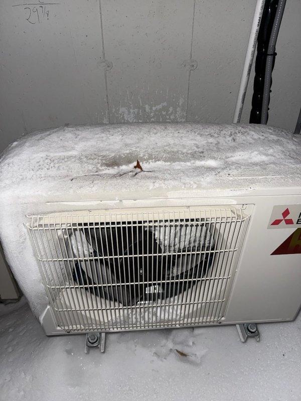 Responded to warranty service call for Mitsubishi mini-split system in detached garage exhibiting no heat operation. Diagnosed severe ice accumulation on outdoor unit due to failed thermistors. Replaced defective thermistors under warranty, restoring proper system operation and resolving the abnormal frost buildup condition.