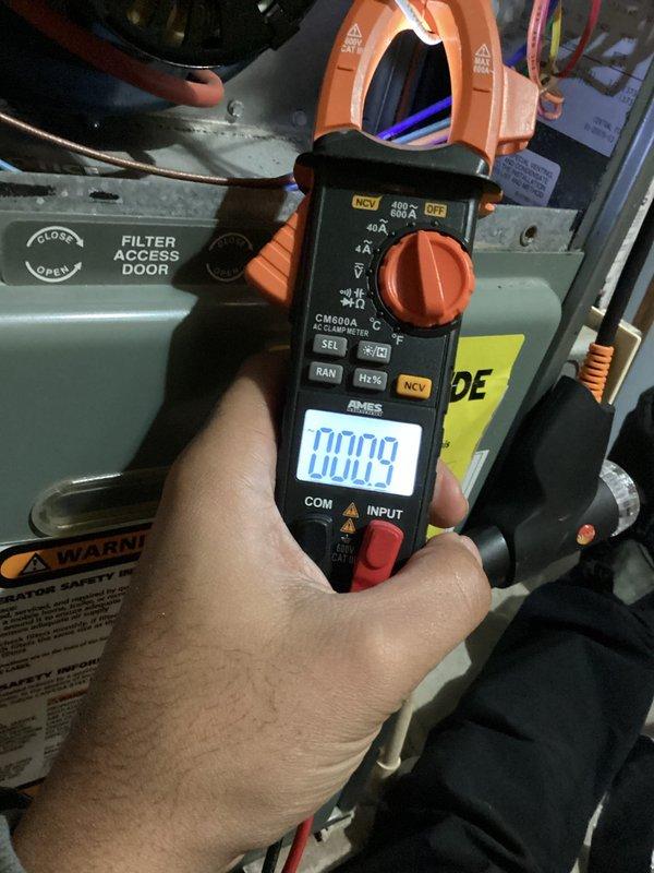 Conducted comprehensive maintenance service on a 19-year-old furnace that has reached the end of its expected service life (15-20 years). Performed complete safety, efficiency, and reliability inspection, including electrical measurements with clamp meter (detected 0.009 amp reading). Noted several concerns with the aging unit, which were documented with supporting photographs of the system components and adjacent A.O. Smith ProMax water heater installation.