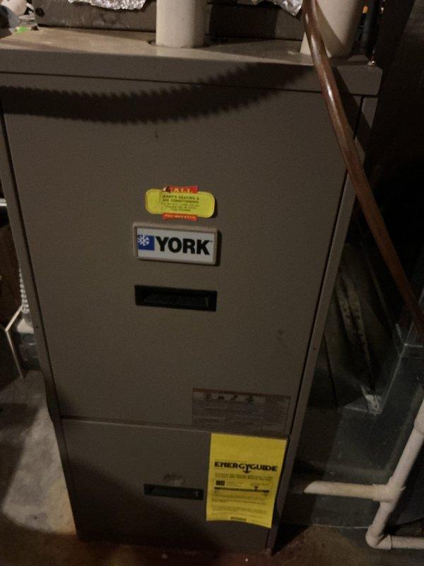 Replaced 67-gallon electric water heater that had catastrophically failed after 19+ years of service. Original unit exhibited significant corrosion with vertical split along tank seam causing active leakage. Installed new 50-gallon electric water heater and established customer on preventative maintenance program.