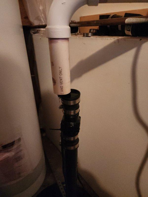 Responded to customer service call for disconnected sump pump discharge pipe. Discovered check valve was detached due to insufficient pipe length, causing the system to malfunction and begin filling to flooding point. Replaced elbow fitting and extended discharge pipe to proper length, ensuring secure connection to check valve and restoring proper sump pump operation.