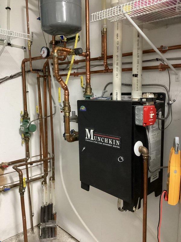 Responded to service call for in-floor heating system with F09 error code (ignition failure). Inspected Munchkin boiler and found dirty igniter and flame sensor. Cleaned components, which resolved the immediate issue and restored proper operation. Recommended replacement of flame sensor and igniter as preventative maintenance due to lack of previous service history and known issues with these components.