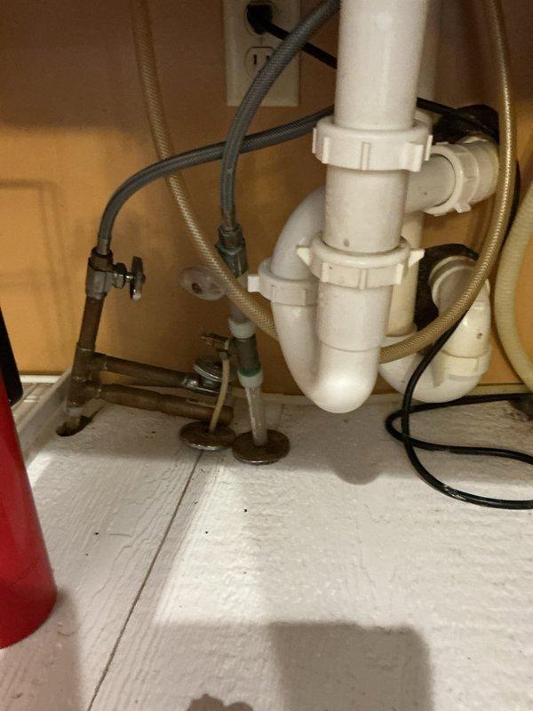Responded to emergency service call to address main water line leak in basement. Successfully replaced faulty valve before the water meter after city water shutdown. Additionally, removed old saddle valve under kitchen sink and installed new valve for refrigerator icemaker connection, restoring proper water supply to both systems.