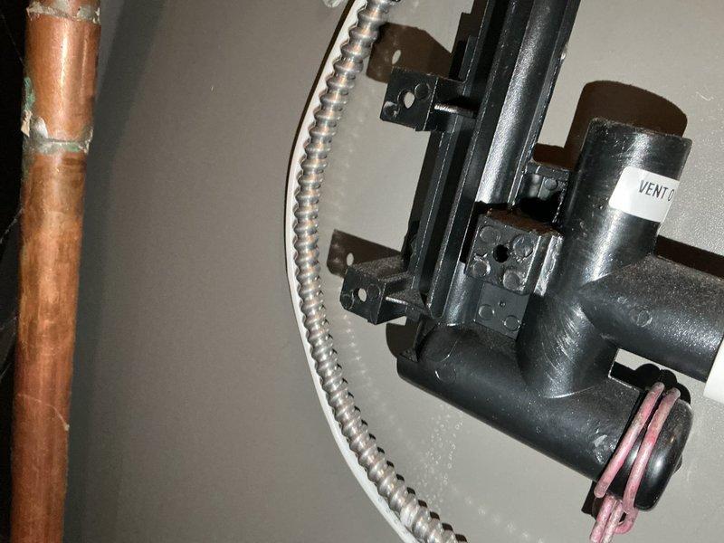 Performed routine furnace inspection on 3-year-old system. All components functioning within specifications with safe CO levels in flue. Identified and corrected condensation leak below the condensate trap by adjusting misaligned end cap and tightening clamp, successfully resolving the immediate issue. Customer advised that trap replacement may be necessary if leakage recurs.