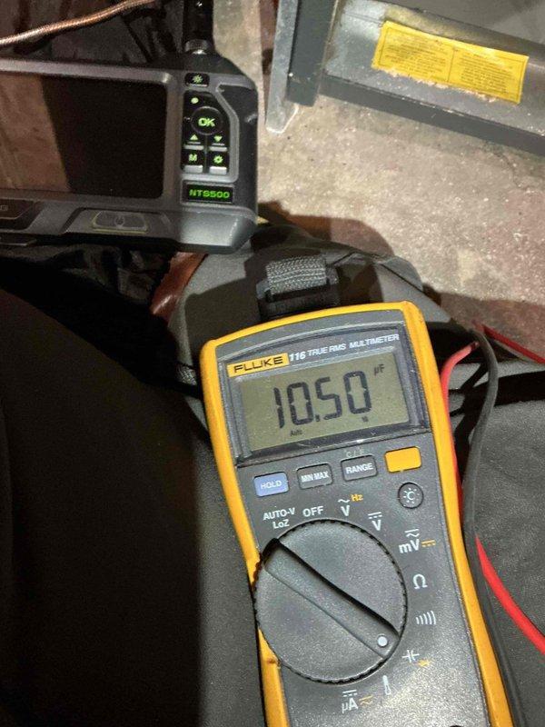 Performed comprehensive tune-up on 19-year-old Goodman furnace. Diagnostic testing included combustion analysis via Testo 310 and electrical measurements with Fluke 116 multimeter, confirming proper function of igniter, flame sensor, gas valve, control board, draft motor, and heat exchanger integrity. Replaced blower capacitor which tested below manufacturer specifications. Noted early signs of potential future heat exchanger deterioration that should be monitored.