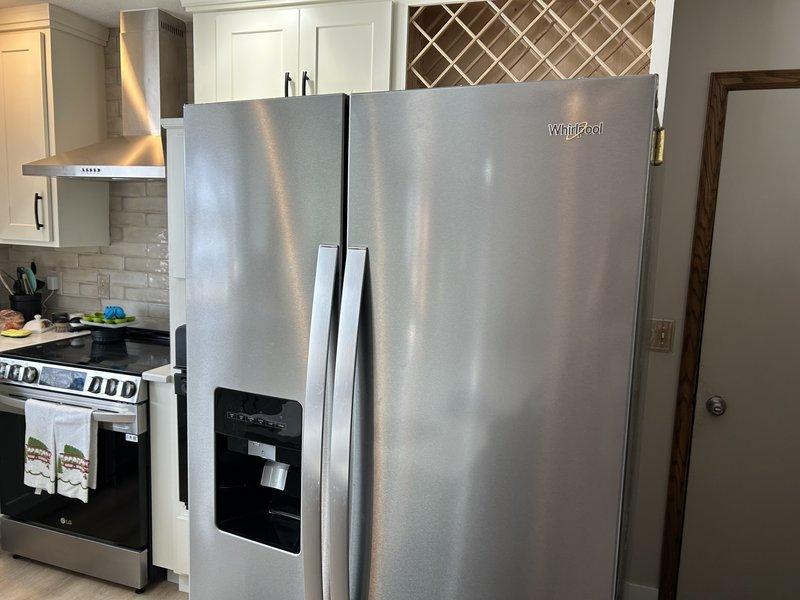 Responded to service call for water line connection to Whirlpool refrigerator. Upon inspection, determined water supply system was functioning properly with adequate line pressure at the filter assembly, but no water was dispensing from the refrigerator outlet. Diagnosed issue as internal refrigerator malfunction rather than plumbing problem. Advised customer to contact Whirlpool manufacturer for warranty service.