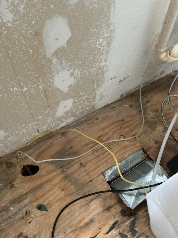 Responded to water damage issue caused by split icemaker water supply line. Installed new copper waterline behind refrigerator, replaced angle stops to kitchen faucet, and installed new Moen cartridge in tub shower. Completed copper tubing installation with appropriate shut-off valve for ice maker line.