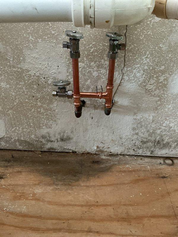 Responded to water damage issue caused by split icemaker water supply line. Installed new copper waterline behind refrigerator, replaced angle stops to kitchen faucet, and installed new Moen cartridge in tub shower. Completed copper tubing installation with appropriate shut-off valve for ice maker line.