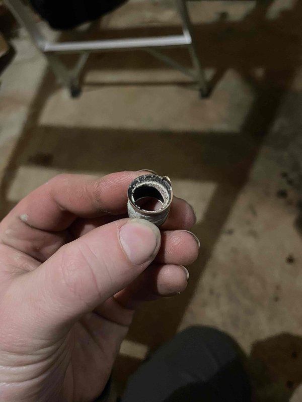 Responded to emergency service call for gas odor after a boiler installation. Identified and repaired a significant gas leak at the incoming line where the flare connection to regulator was damaged. Cut out compromised section, replaced flare fitting, and pressure tested all accessible connections to verify system integrity. Relit boiler, water heater, dryer, stove, and fireplace after confirming no additional leaks. Advised customer to continue ventilating the area to dissipate residual gas odor.