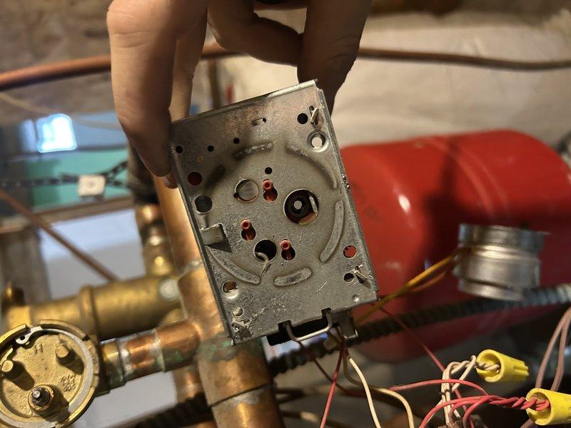 Performed diagnostic inspection on zone valve system and identified need for power head replacement. Upon arrival, discovered incorrect replacement part was provided. Documented existing valve configuration with photos showing copper piping assembly and internal components of the current zone valve head. Service to be completed on return visit with proper replacement parts sourced from alternate location.