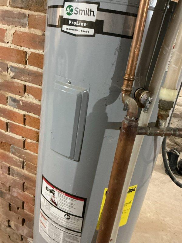 Responded to customer concern regarding high electric bill potentially caused by water heater. Inspected A.O. Smith ProLine commercial grade electric water heater installed in 2019. Performed amperage testing and confirmed unit was not drawing power as it is currently being heated by customer's wood stove. Verified water heater is not contributing to increased electrical consumption.