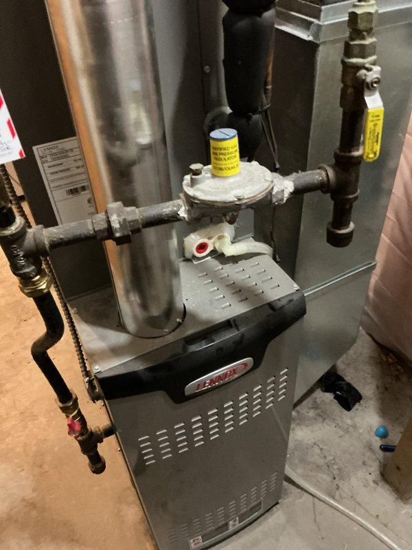 Responded to service call for non-functioning water heater with reported gas leak. Upon inspection, discovered flame rolling out through side panel due to dirty components rather than faulty gas valve or burner assembly. Performed thorough cleaning of flue vent and burner assembly. Additionally, identified and replaced non-functioning temperature and pressure relief valve to restore proper safety function. Water heater now operating correctly with proper flame containment.