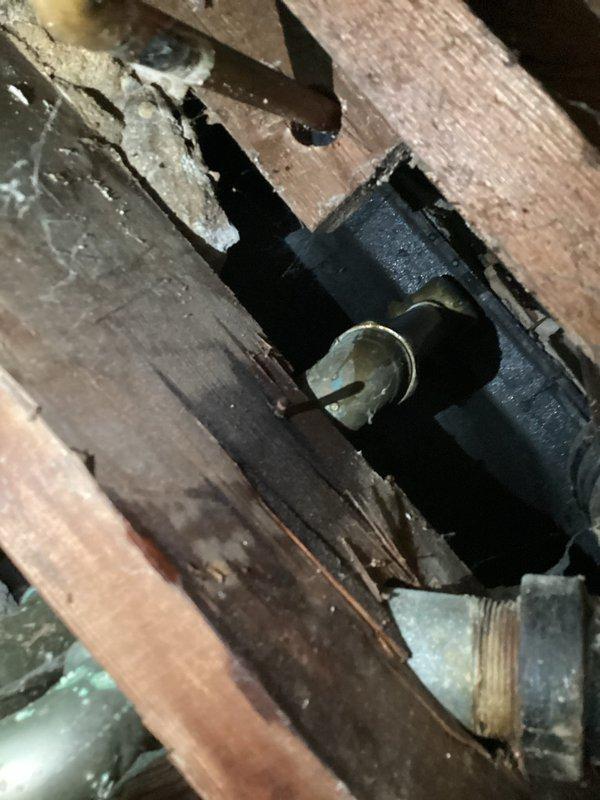 Investigated and repaired water leakage from bathtub/shower area that was penetrating through ceiling into basement below. Identified two sources of water intrusion: defective overflow assembly and deteriorated seal around left shower handle. Presented customer with multiple remediation options and completed necessary repairs to prevent further water damage to structural components.