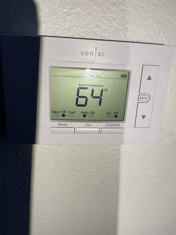 Diagnosed 2007 natural gas furnace with complete system failure after customer reported burning smell. Investigation revealed seized blower motor, which explains both the burning odor and system shutdown. Ordered replacement blower motor specific to the Nordang unit. Verified thermostat was operational but unable to engage heating cycle due to failed motor component.
