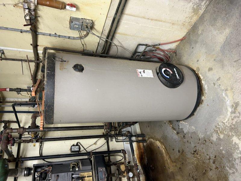Responded to service call for non-operational boiler that was failing to fire up. Diagnosed issue to be a faulty pressure switch with a broken spade terminal. Also identified and addressed a dip in the intake pipe, drilling a weep hole to check for water infiltration (none found). Replaced pressure switch, restoring heat and hot water functionality for the property.