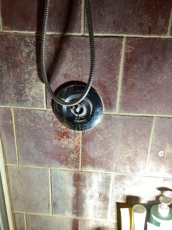 Replaced defective cartridge in stand-up shower to address handle leakage. Installed new shower valve to resolve valve leakage at shower assembly that had caused significant mineral buildup and water damage to surrounding tile. Additionally, installed new valve for laundry tub on lower level as requested.