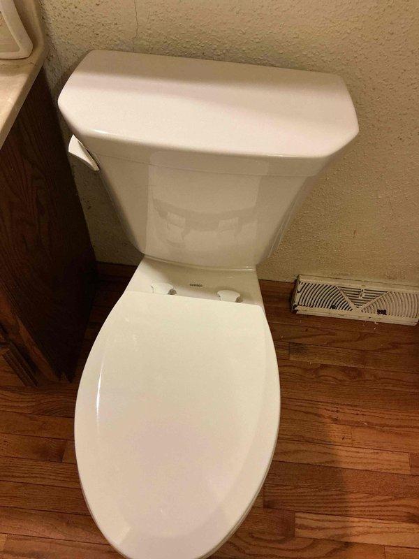 Responded to service call for clogged toilet. Upon inspection, found extensive calcification inside toilet bowl preventing effective augering. Completed rebuild of toilet flange and installed new white porcelain toilet with standard tank. Verified proper installation and functionality before completion.