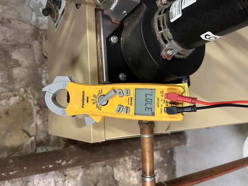 Performed comprehensive boiler tune-up including operational testing across all zones. Cleaned pilot assembly components (spark rod and flame sensor), inspected heat exchanger, verified proper system pressure, and tested electrical components. Replaced batteries in two thermostats to ensure reliable zone control functionality. All systems operating within normal parameters.