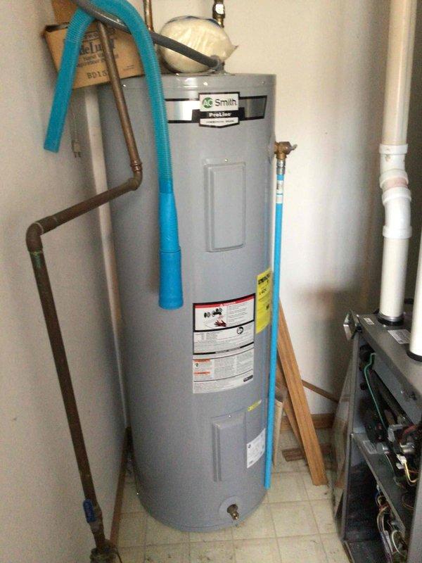 Performed standard furnace maintenance tune-up on residential unit. System functioning within normal parameters after cleaning flame sensor, testing electrical components, and removing wasp nest from intake. No operational issues detected.