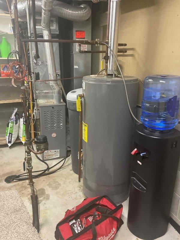 Diagnosed natural gas water heater with no hot water issue; identified defective thermocouple as root cause. Replaced thermocouple to restore proper function and hot water supply to residence.