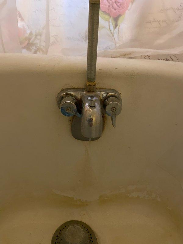 Responded to customer report of continuous drip from clawfoot tub faucet. Performed diagnostic inspection revealing severe mineral buildup and worn internal components causing leak. Successfully cleared drain obstruction by snaking and removing significant hair accumulation. Completed measurements for replacement parts and submitted order form for new clawfoot tub faucet assembly to permanently resolve the leak issue.