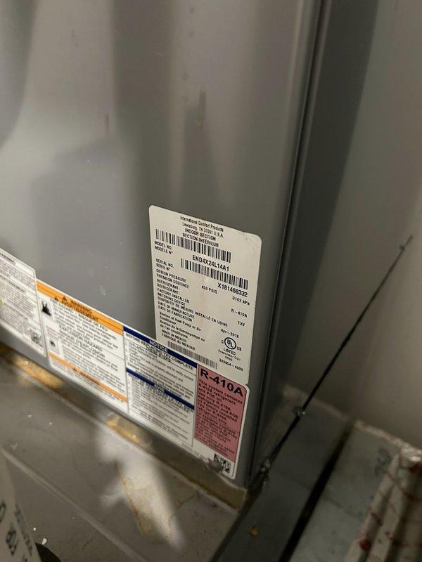 Responded to no heat call at 7-year-old residence. Diagnosed issue was thermostatic control error - resident had inadvertently set system to cooling mode while dusting. Restored proper operation by switching thermostat to heating mode, verified system startup and proper function. Equipment inspection confirmed R-410A system in satisfactory condition.