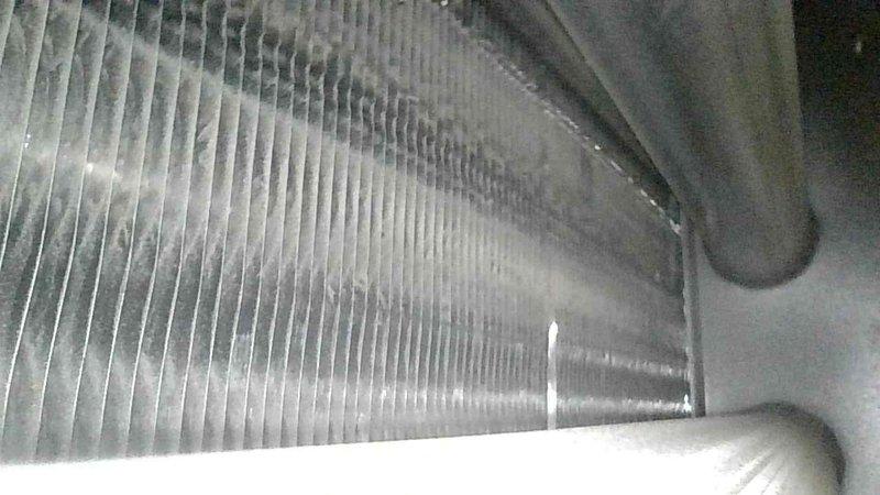 Performed annual tune-up on aging Goodman furnace. Service included cleaning heat exchanger fins, testing operational systems, and flushing condensate drain line. Advised customer on proper filter maintenance and discussed potential future issue with cold end header box, which is not currently leaking but is a known vulnerability with this model.